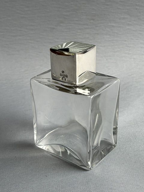 A Stylish Art Deco Silver & Glass Cologne Bottle