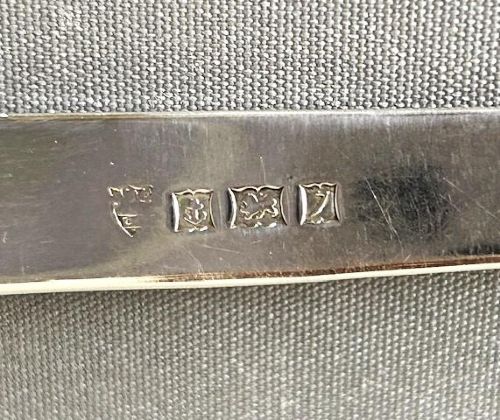 fig 1. A silver letter opener featuring a tapered flat blade and a detailed cast fox head terminal.