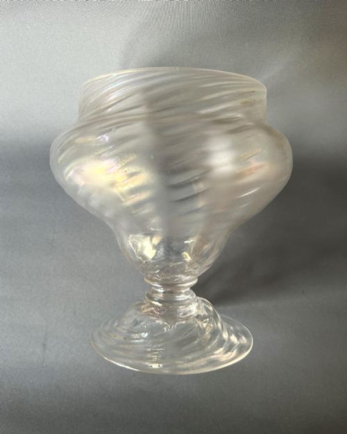 fig 1. An Art Nouveau clear glass pedestal vase featuring a spiralled rib design and an iridescent lustre finish.