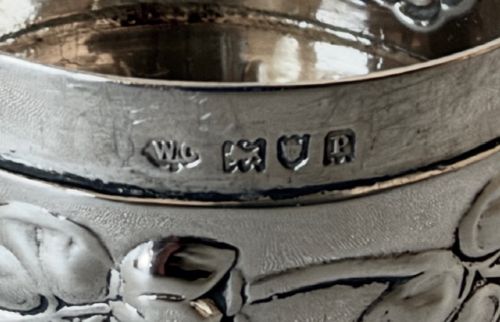 A circular Edwardian sterling silver pot pourri box with a pierced fretwork lid depicting birds and floral scrollwork. View VII