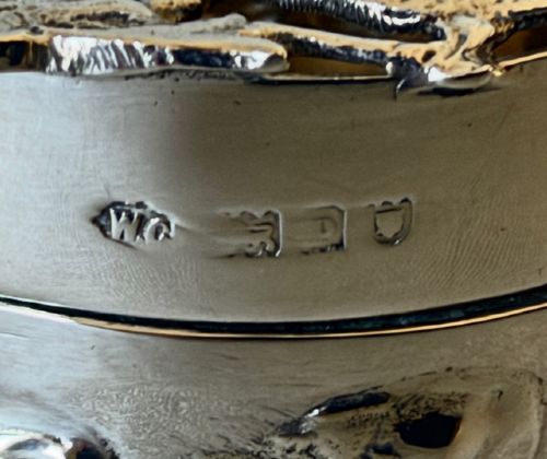 A circular Edwardian sterling silver pot pourri box with a pierced fretwork lid depicting birds and floral scrollwork. View VIII