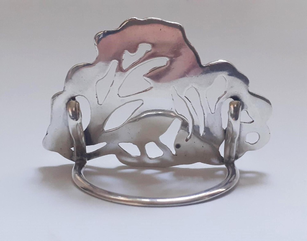 A pair of Victorian pierced sterling silver menu card holders featuring detailed bird and botanical foliage designs. View II