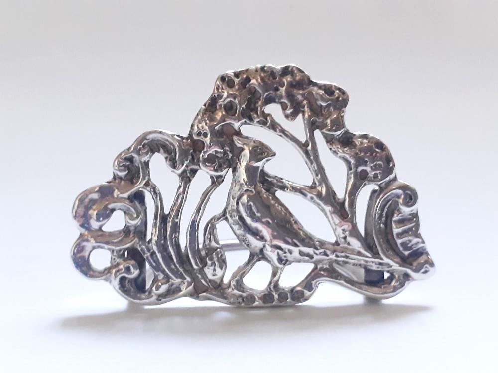 A pair of Victorian pierced sterling silver menu card holders featuring detailed bird and botanical foliage designs. View IX