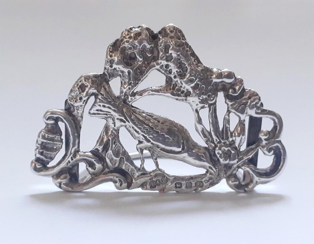 A pair of Victorian pierced sterling silver menu card holders featuring detailed bird and botanical foliage designs. View XI
