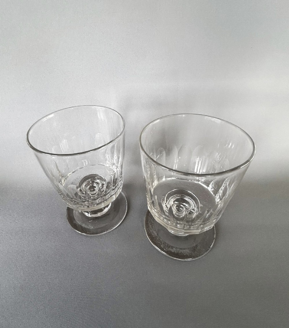 A pair of clear glass Georgian rummers featuring cut fluted bowls, knopped stems, and flat circular bases. View II