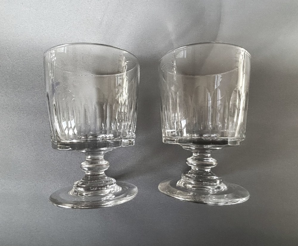 A pair of clear glass Georgian rummers featuring cut fluted bowls, knopped stems, and flat circular bases. View IV