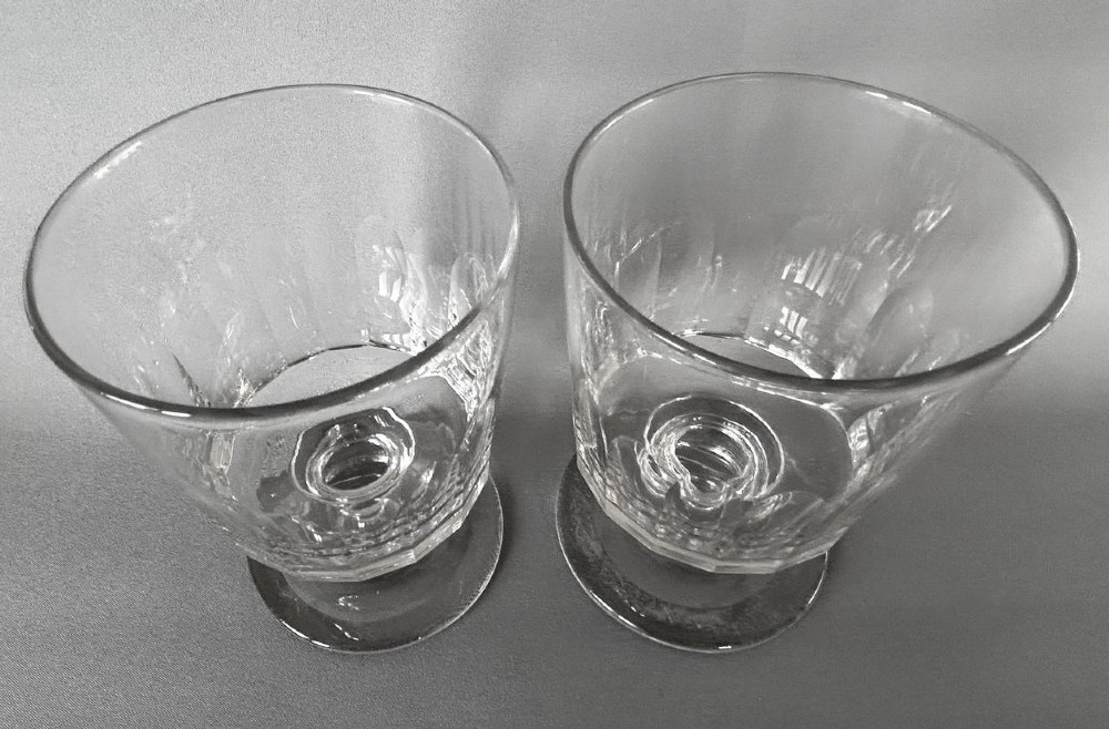 A pair of clear glass Georgian rummers featuring cut fluted bowls, knopped stems, and flat circular bases. View VI