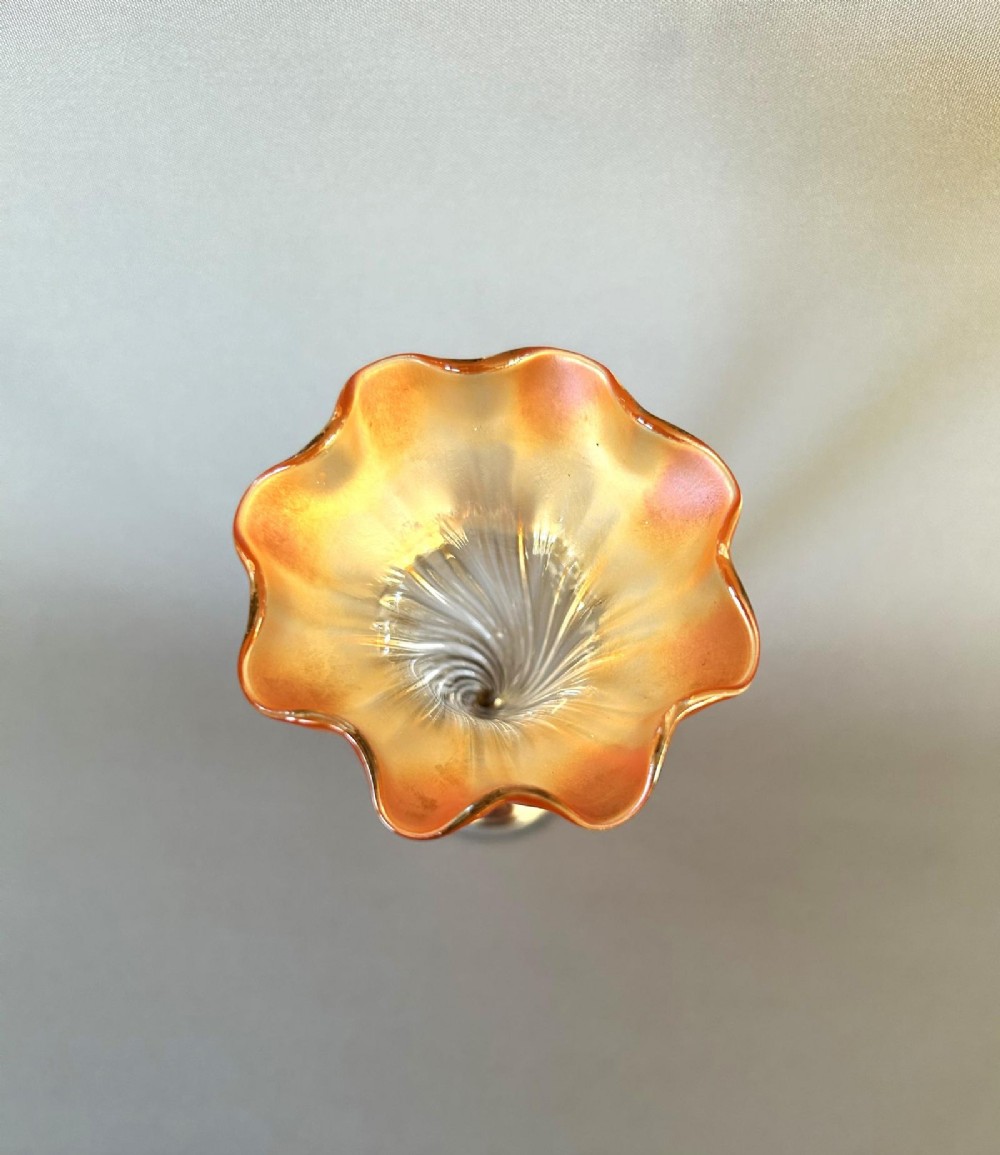An Edwardian posy vase featuring a wrythen glass trumpet with a flared orange rim, set into a silver pedestal base. View III