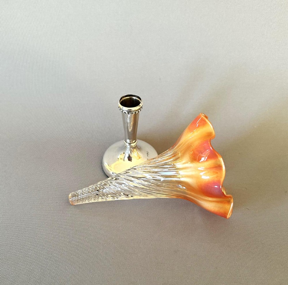 An Edwardian posy vase featuring a wrythen glass trumpet with a flared orange rim, set into a silver pedestal base. View IV