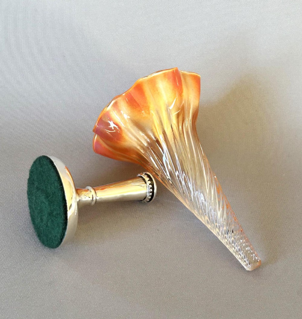 An Edwardian posy vase featuring a wrythen glass trumpet with a flared orange rim, set into a silver pedestal base. View VI
