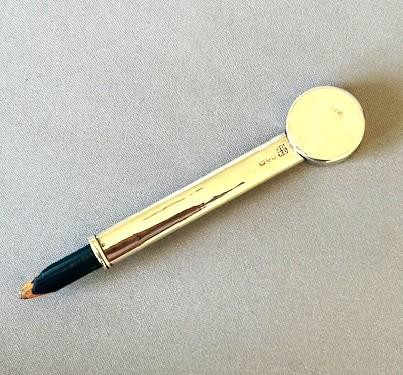An Edwardian sterling silver mechanical pencil featuring a circular rotating trump marker dial at the top. View II