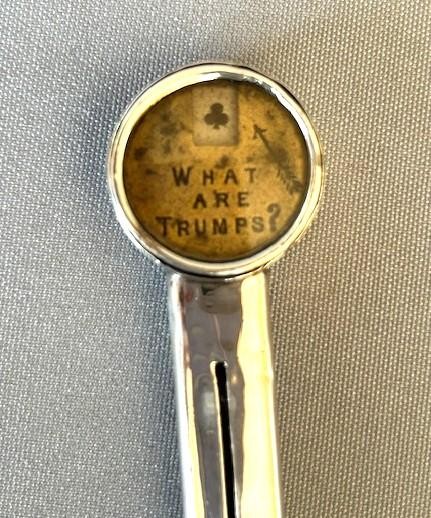 An Edwardian sterling silver mechanical pencil featuring a circular rotating trump marker dial at the top. View V