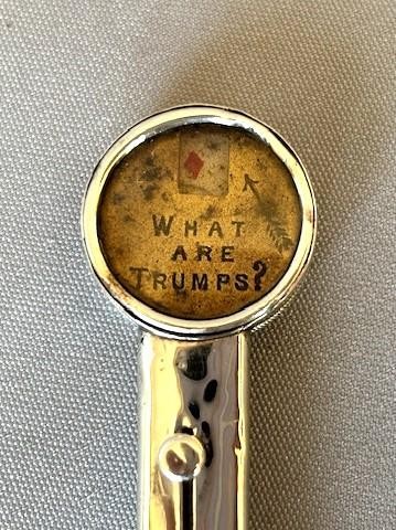 An Edwardian sterling silver mechanical pencil featuring a circular rotating trump marker dial at the top. View VI
