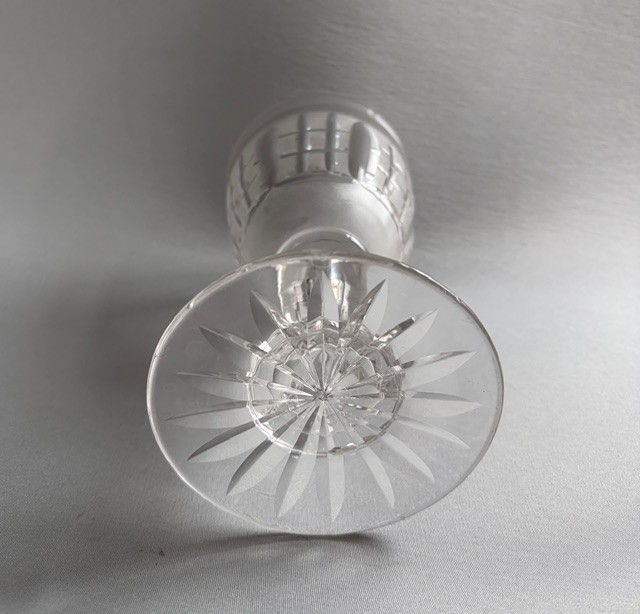 A clear Victorian cut crystal wine goblet featuring a frosted geometric pattern, faceted stem, and star-cut base. View VI