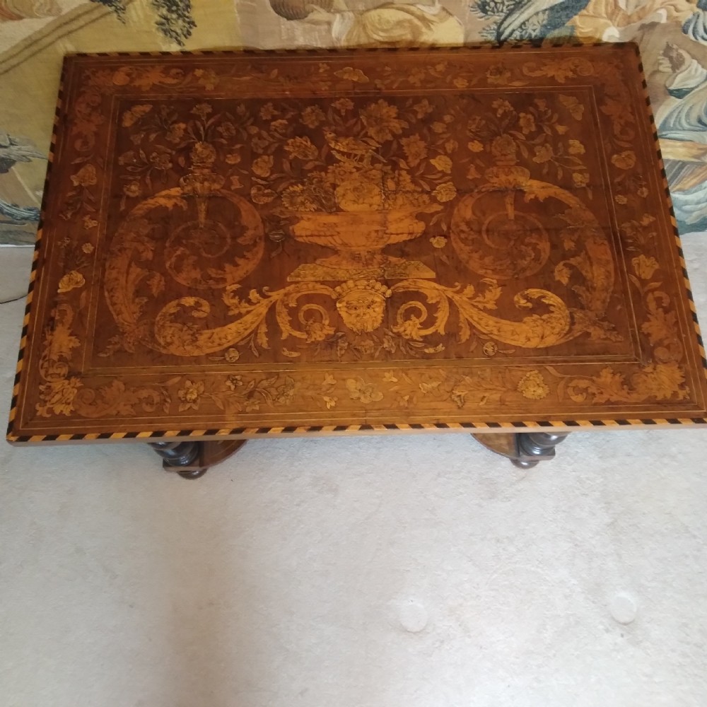 An 18th-century rectangular wooden centre table featuring elaborate floral marquetry inlay on the top, twisted legs, and a curvilinear X-frame stretcher. View III
