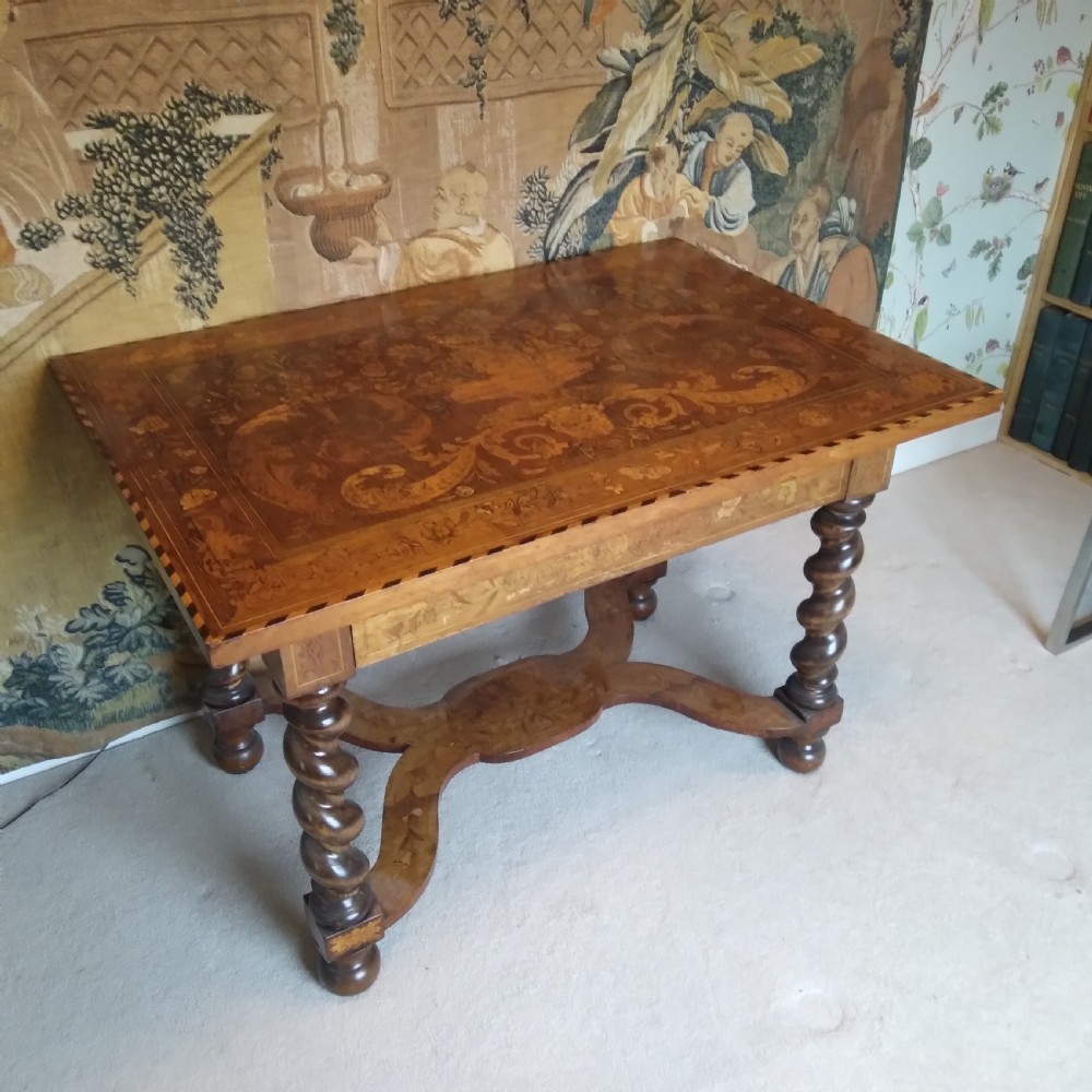 An 18th-century rectangular wooden centre table featuring elaborate floral marquetry inlay on the top, twisted legs, and a curvilinear X-frame stretcher. View XIII