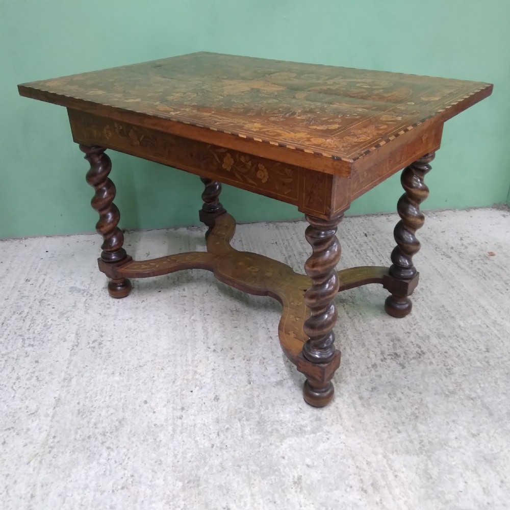 An 18th-century rectangular wooden centre table featuring elaborate floral marquetry inlay on the top, twisted legs, and a curvilinear X-frame stretcher. View XXVIII