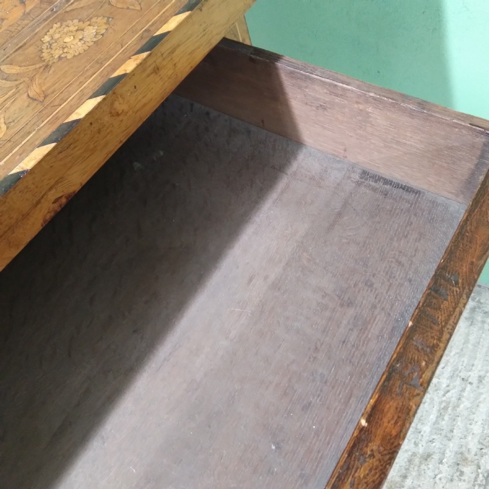 An 18th-century rectangular wooden centre table featuring elaborate floral marquetry inlay on the top, twisted legs, and a curvilinear X-frame stretcher. View XXX