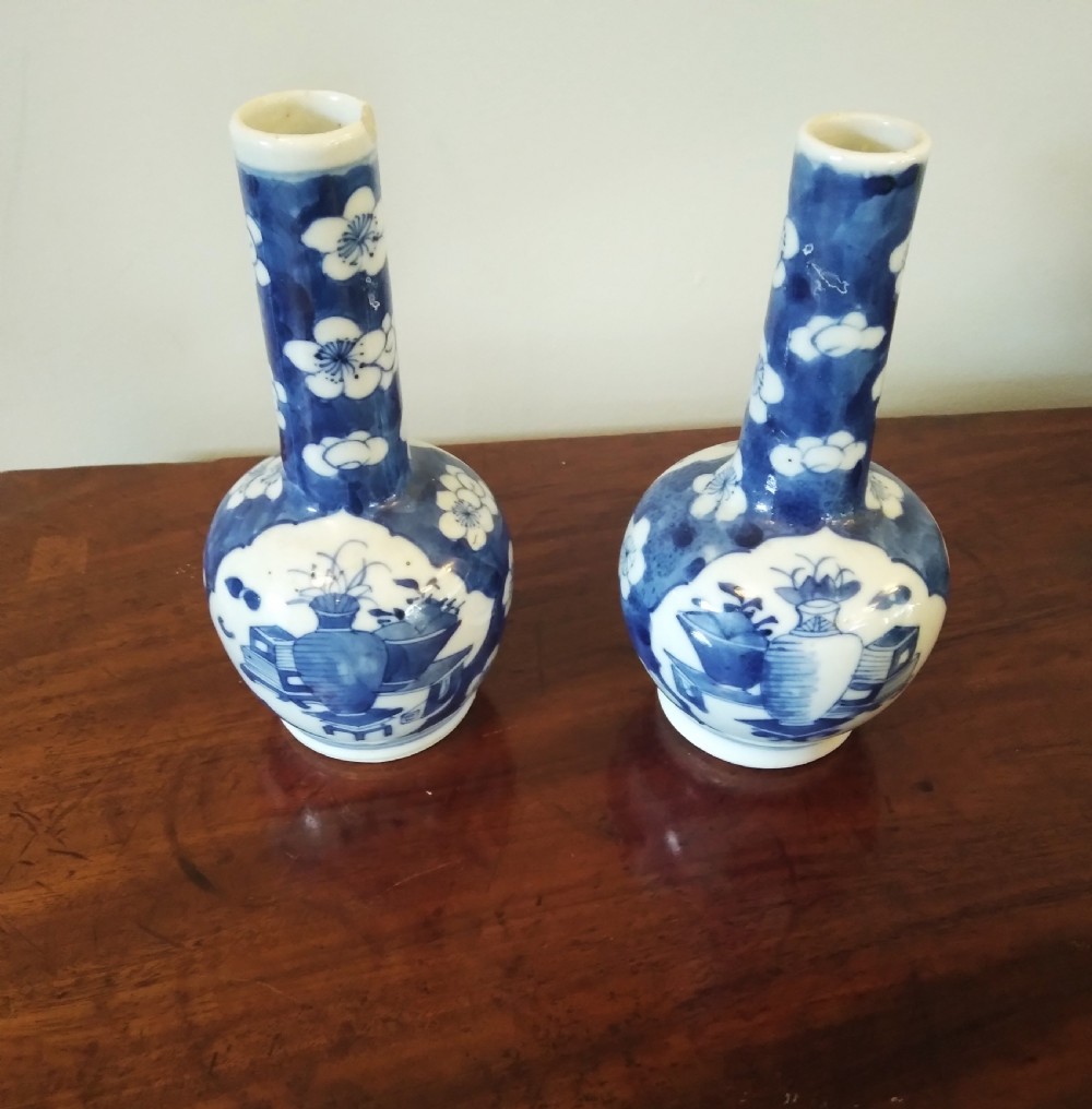A collection of varied Chinese blue and white and polychrome porcelain vases, bowls, and jars displayed along a dark wood sideboard. View VIII