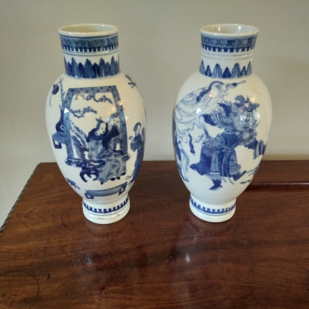 A collection of varied Chinese blue and white and polychrome porcelain vases, bowls, and jars displayed along a dark wood sideboard. View XIX