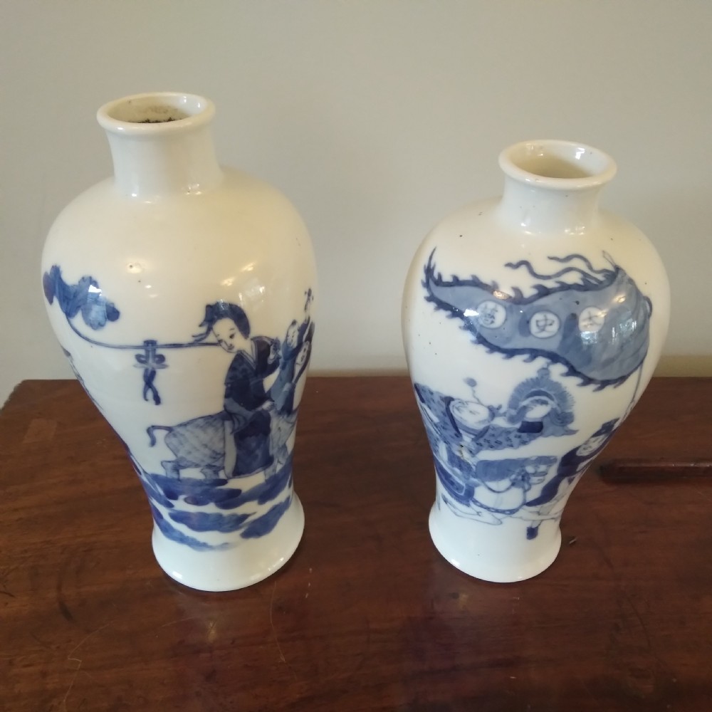 A collection of varied Chinese blue and white and polychrome porcelain vases, bowls, and jars displayed along a dark wood sideboard. View XXII