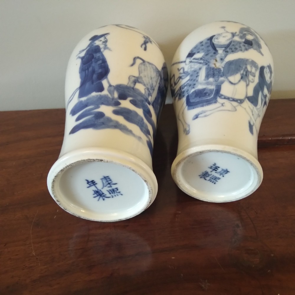 A collection of varied Chinese blue and white and polychrome porcelain vases, bowls, and jars displayed along a dark wood sideboard. View XXIII