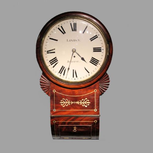 a late regency english dropdial fusee wall clock in a brass inlaid mahogany case bowed dial by thomas lindey of bristol circa 1830 - CATEGORY: ANTIQUE CLOCKS - DATED 19TH CENTURY