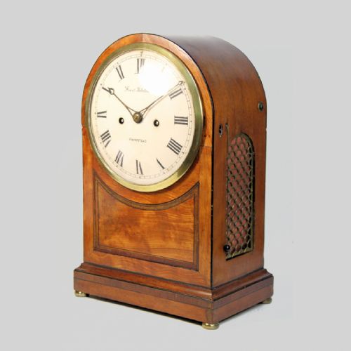 fig 1. ARCHED FUSEE BRACKET CLOCK IN A MIXED WOOD CASE. SIGNED FRANCIS ROBOTHAM, HAMPSTEAD. CIRCA 1800.
