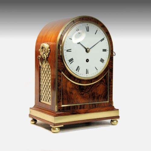 a good table clock in an arched rosewood and brassbound case by thomas gammage london circa 1835 - CATEGORY: ANTIQUE CLOCKS - DATED 19TH CENTURY