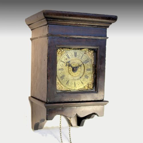 a rare 17th century early english hooded wall clock in an oak case with a timepiece alarum movement circa 1690 - CATEGORY: ANTIQUE CLOCKS - DATED 17TH CENTURY