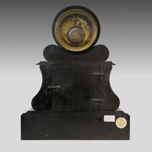fig 3. A late nineteenth-century French garniture clock set crafted from black slate and green marble with a moon phase dial and two matching side pedestals.