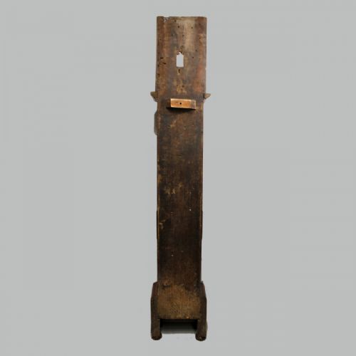 fig 6. A late 17th-century dark oak longcase clock hood featuring barley twist columns, carved frieze moulding, and a square brass dial.