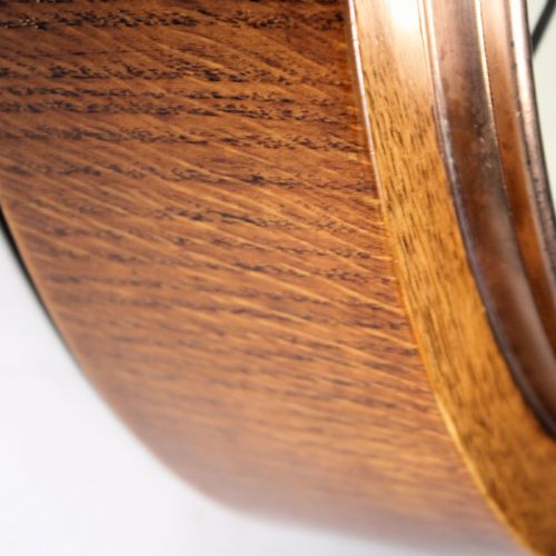 fig 3. A circular twentieth-century oak wall dial clock with black Roman numerals on a cream face, inscribed Fattorini Bradford.