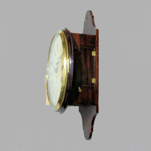 fig 4. A late 18th-century Georgian mahogany wall clock featuring a circular cream painted dial with Roman numerals, a brass bezel, and a salt-box wooden case.