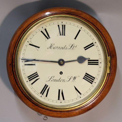 A SMALL, OAK, FUSEE ENGLISH DIAL WALL CLOCK RETAILED BY HARRODS.CIRCA 1890.