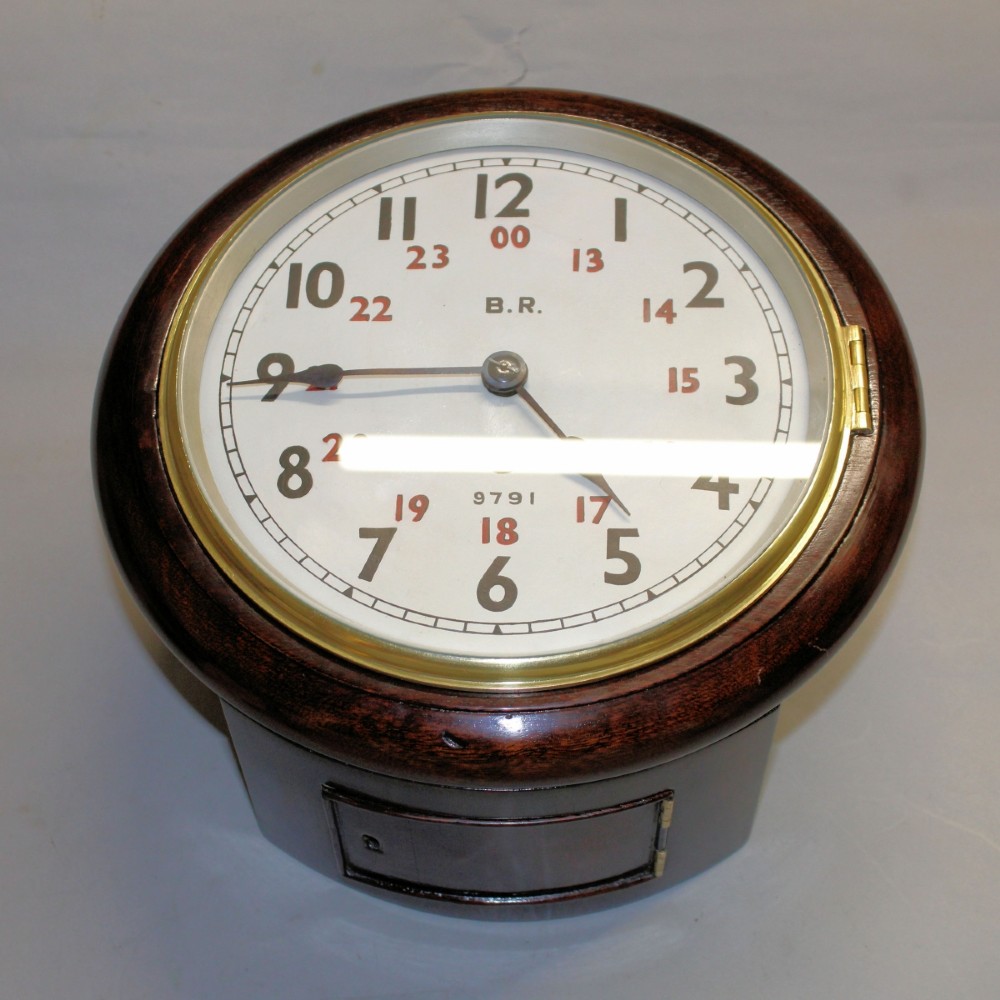A round Victorian mahogany fusee wall clock featuring an eight-inch white dial with black and red numbers and a brass bezel. View II