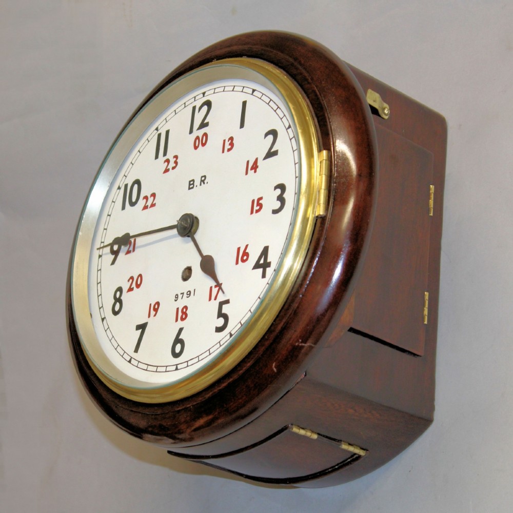 A round Victorian mahogany fusee wall clock featuring an eight-inch white dial with black and red numbers and a brass bezel. View III