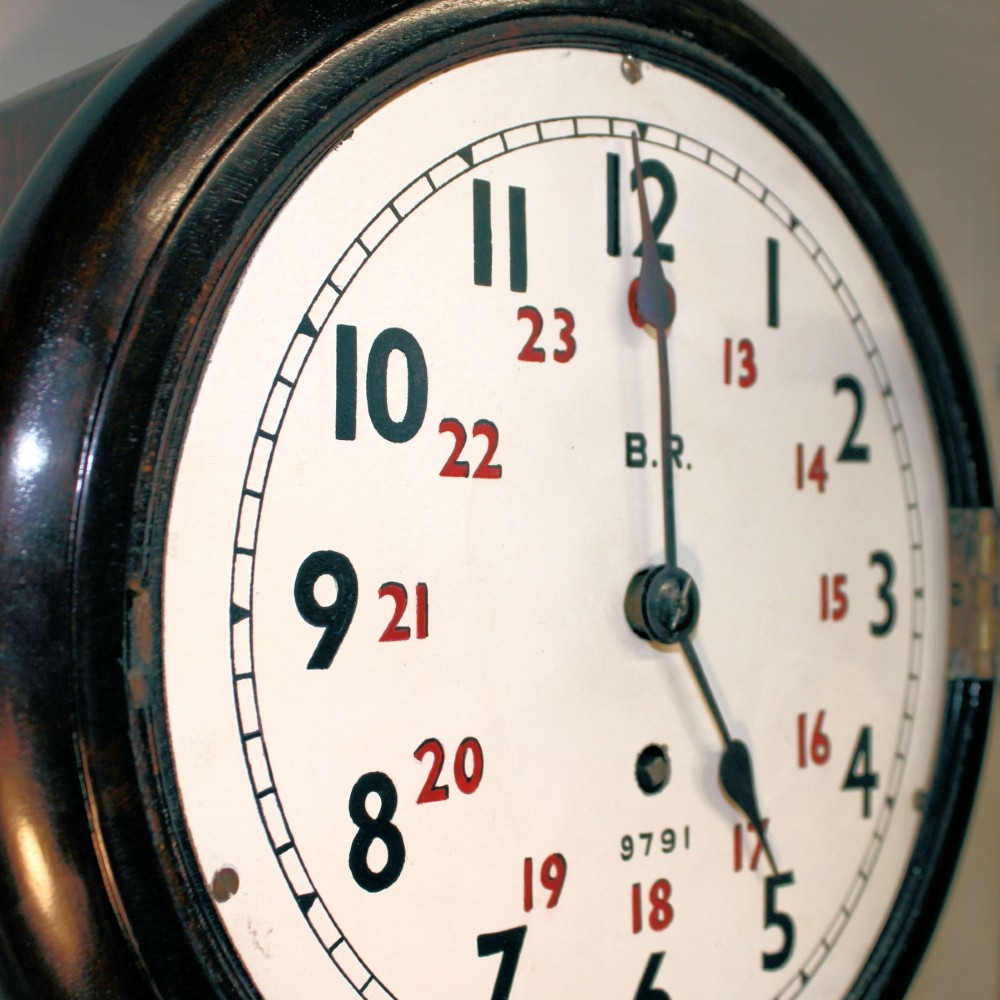 A round Victorian mahogany fusee wall clock featuring an eight-inch white dial with black and red numbers and a brass bezel. View VIII