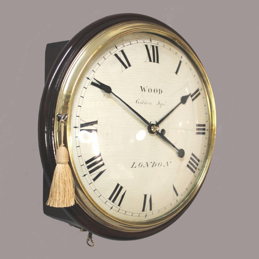 An antique Regency single fusee wall clock featuring an off-white convex wooden dial with Roman numerals, brass bezel, and a dark polished mahogany surround. View II