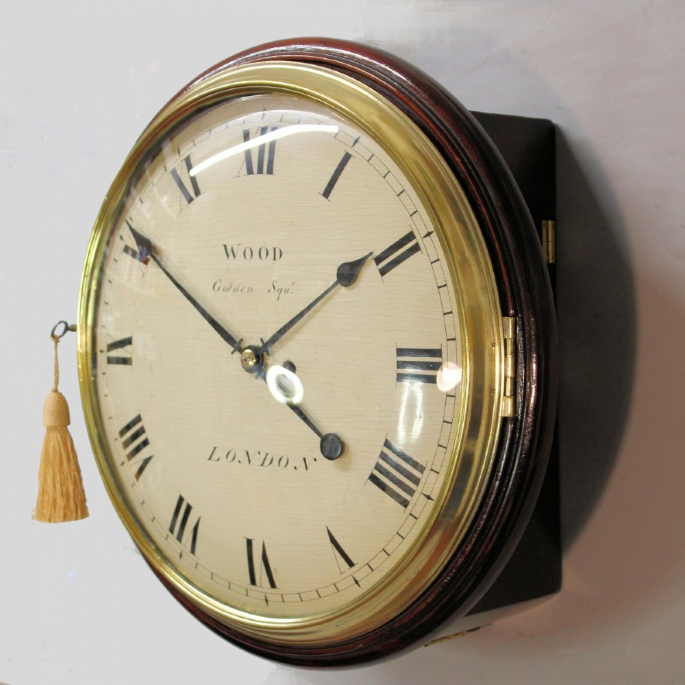 An antique Regency single fusee wall clock featuring an off-white convex wooden dial with Roman numerals, brass bezel, and a dark polished mahogany surround. View III