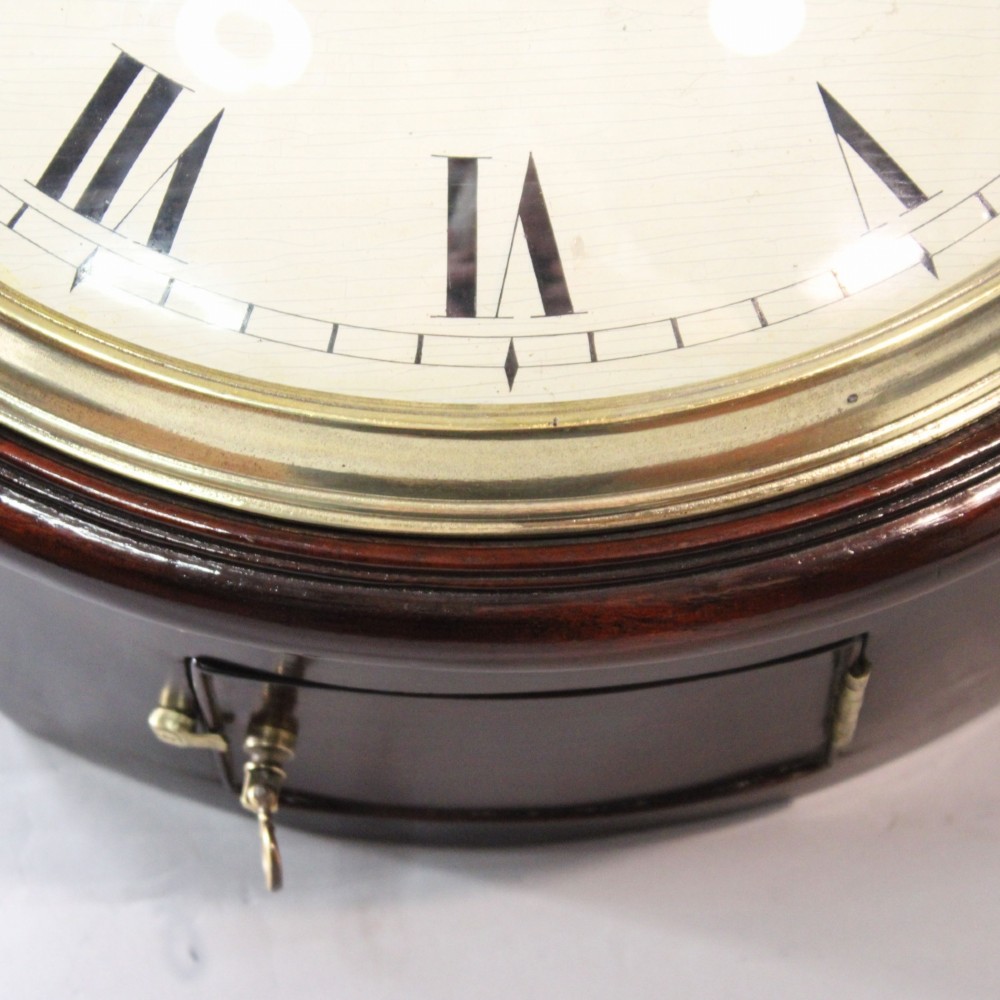 An antique Regency single fusee wall clock featuring an off-white convex wooden dial with Roman numerals, brass bezel, and a dark polished mahogany surround. View VIII