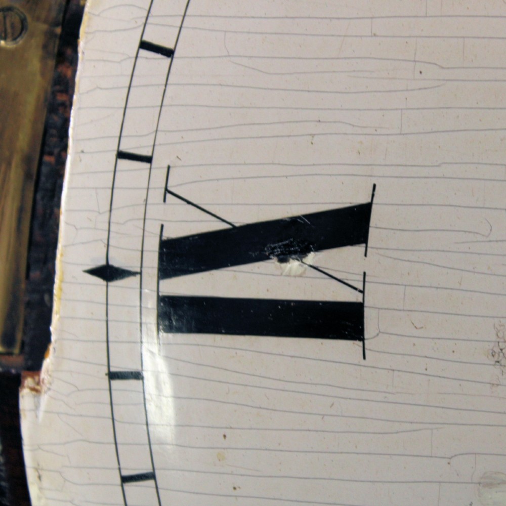 An antique Regency single fusee wall clock featuring an off-white convex wooden dial with Roman numerals, brass bezel, and a dark polished mahogany surround. View XI