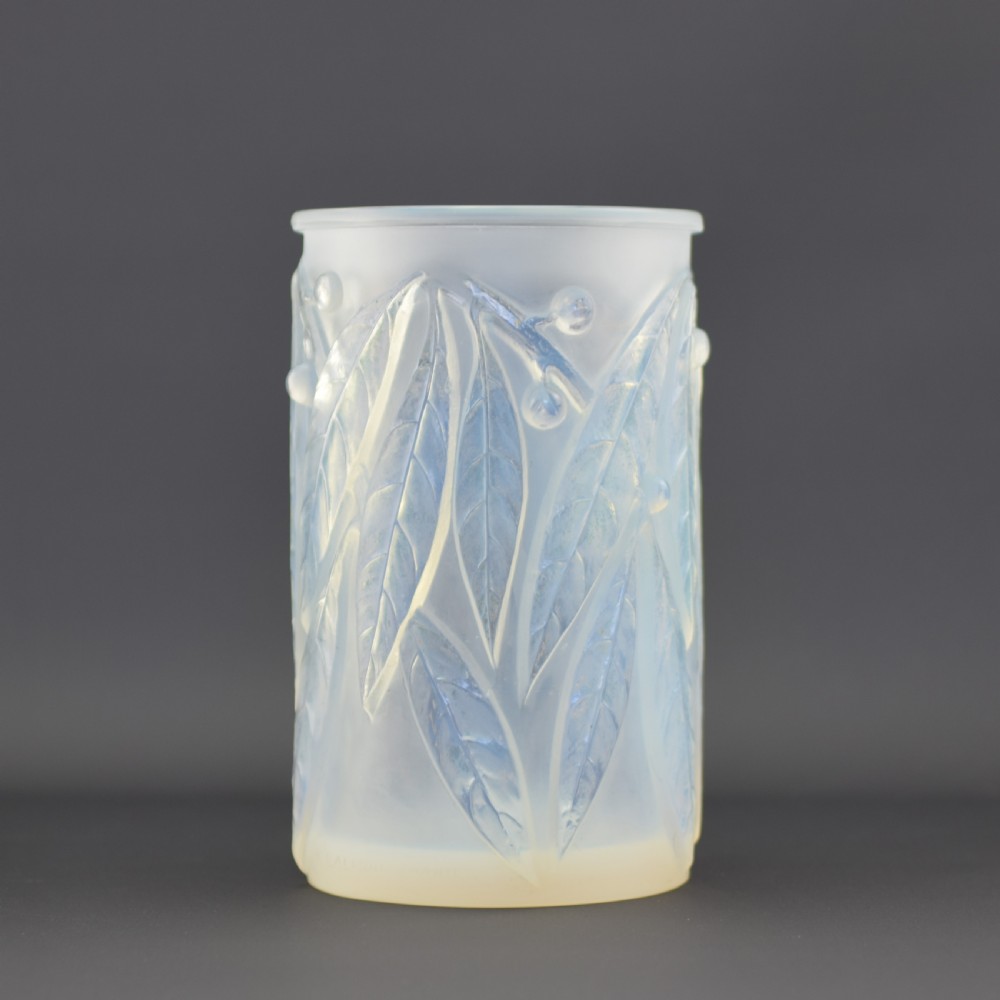 A cylindrical Art Deco opalescent glass vase decorated with relief-moulded laurel leaves and berries. View II
