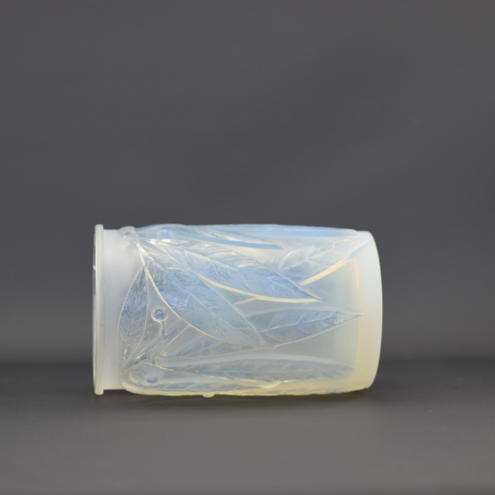 A cylindrical Art Deco opalescent glass vase decorated with relief-moulded laurel leaves and berries. View VI