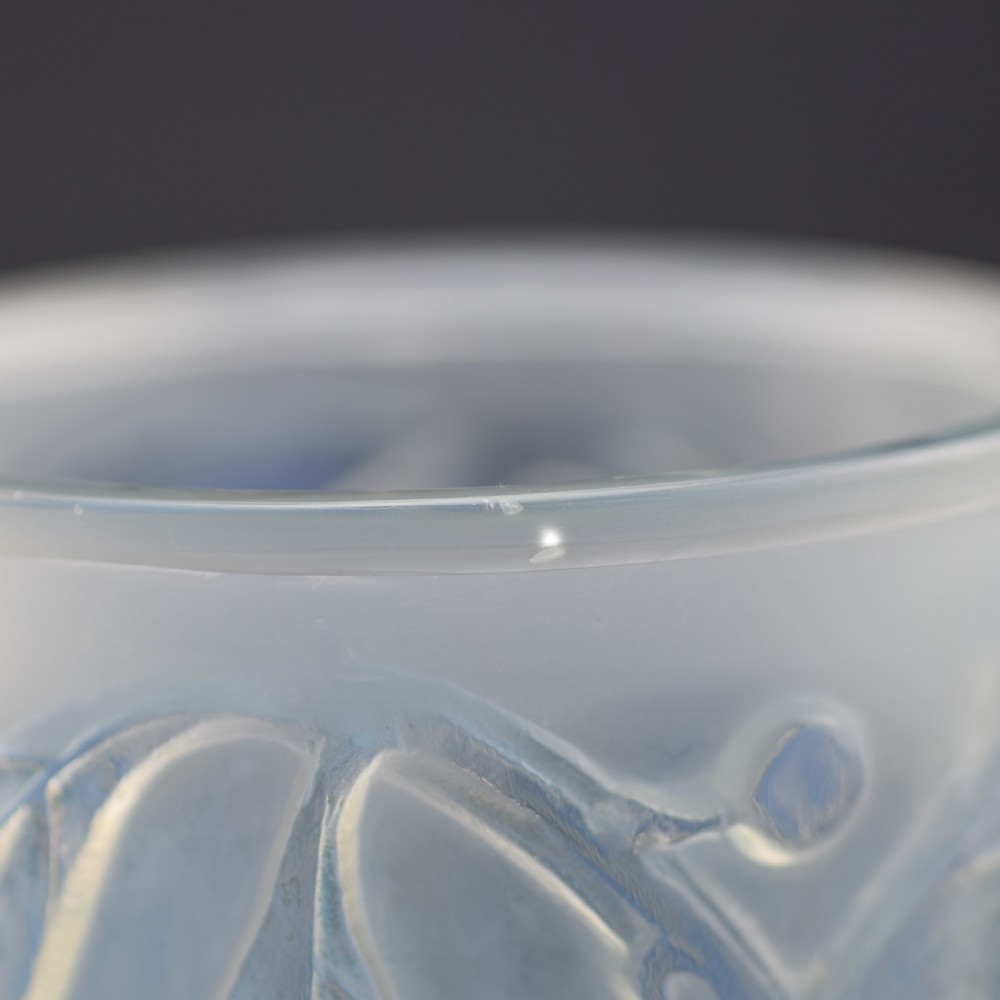 A cylindrical Art Deco opalescent glass vase decorated with relief-moulded laurel leaves and berries. View VII