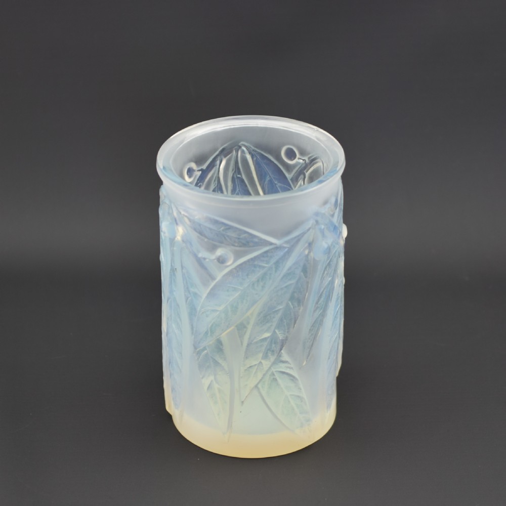 A cylindrical Art Deco opalescent glass vase decorated with relief-moulded laurel leaves and berries. View VIII