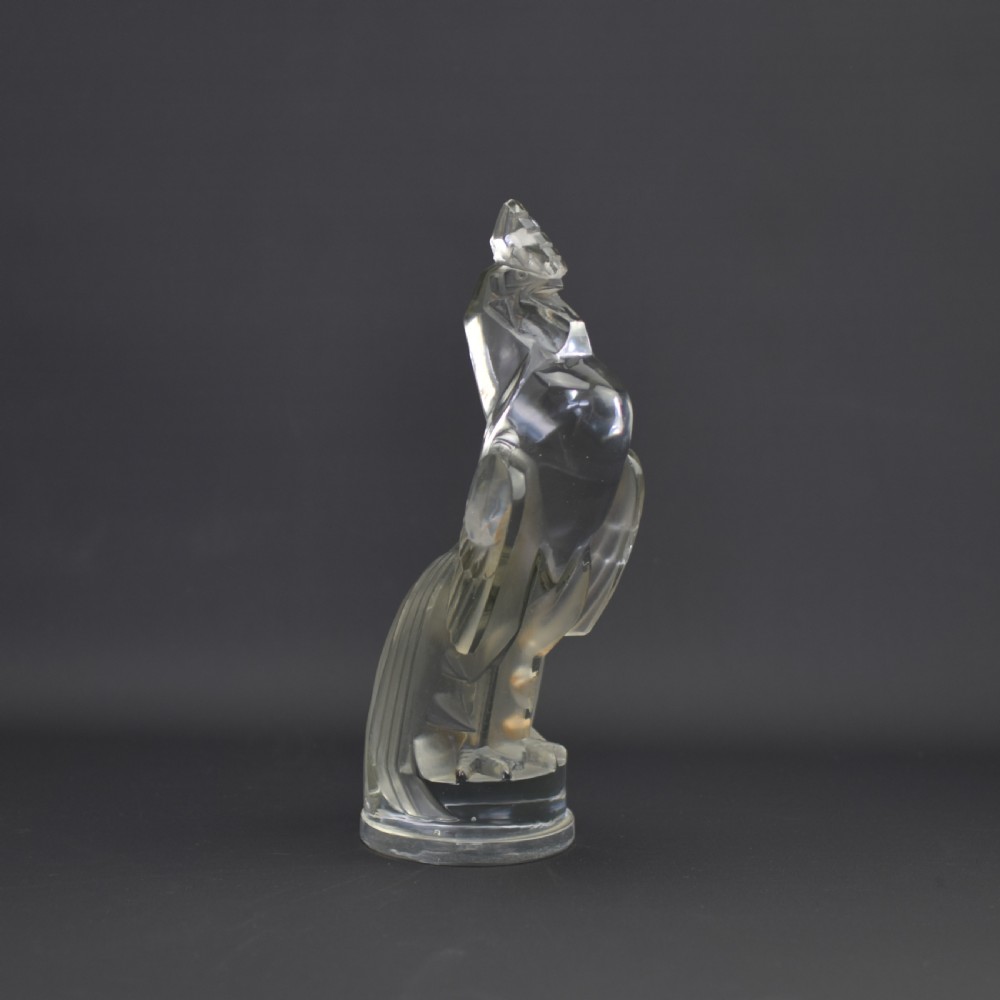 An Art Deco press-moulded clear glass car mascot designed in the form of a stylised standing cockerel. View III