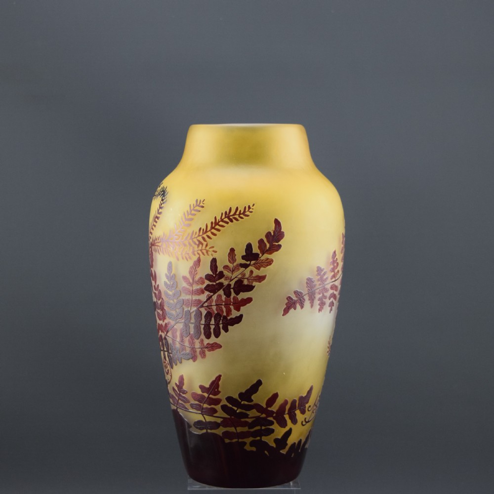 An Art Nouveau cameo glass vase featuring frosted yellow glass acid-etched with dark burgundy fern leaf motifs. View II