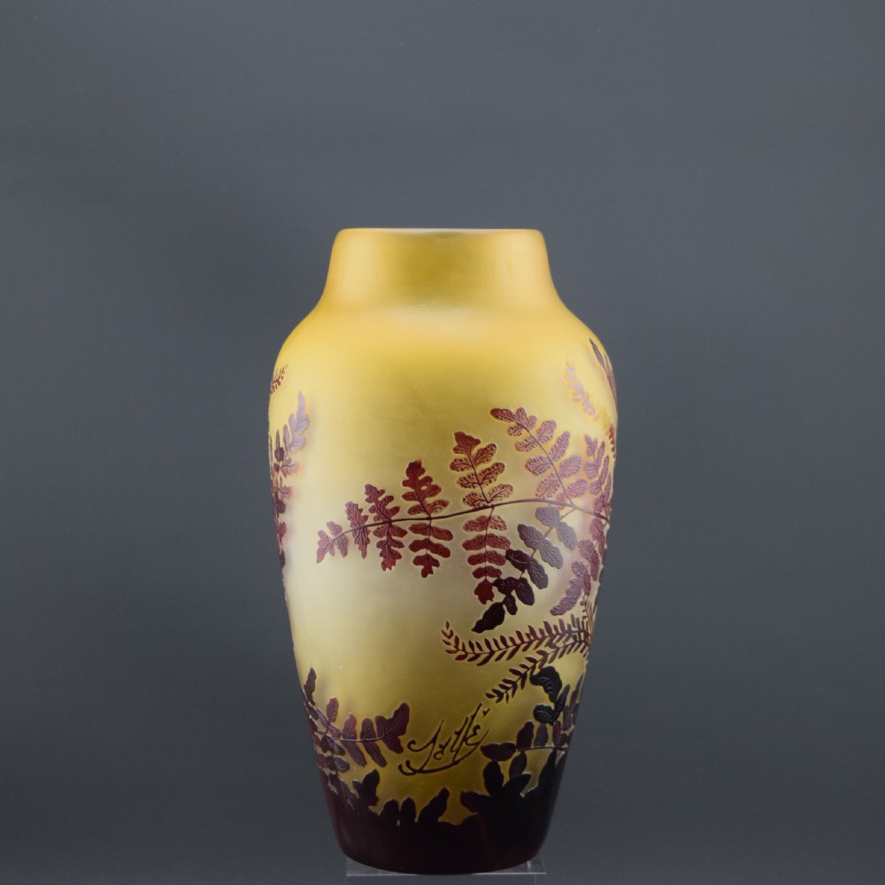 An Art Nouveau cameo glass vase featuring frosted yellow glass acid-etched with dark burgundy fern leaf motifs. View III