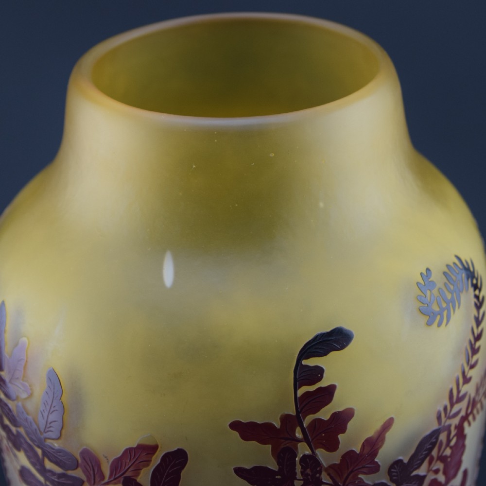 An Art Nouveau cameo glass vase featuring frosted yellow glass acid-etched with dark burgundy fern leaf motifs. View VII
